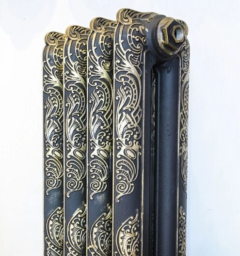 blu grey cast iron radiator with glod ornaments